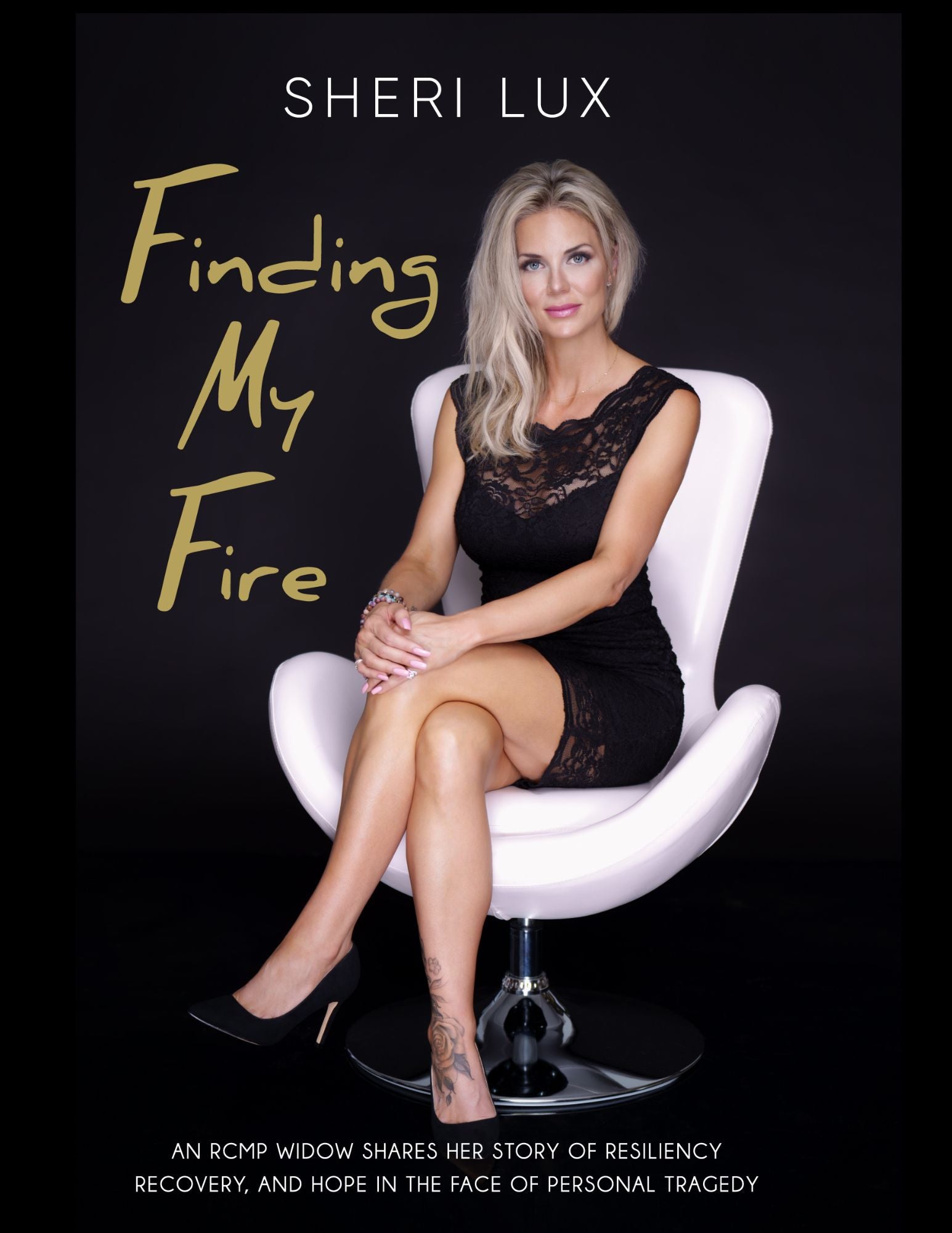 Book cover of 'Finding My Fire' by Sheri Lux featuring a woman in a black dress sitting on a white chair.