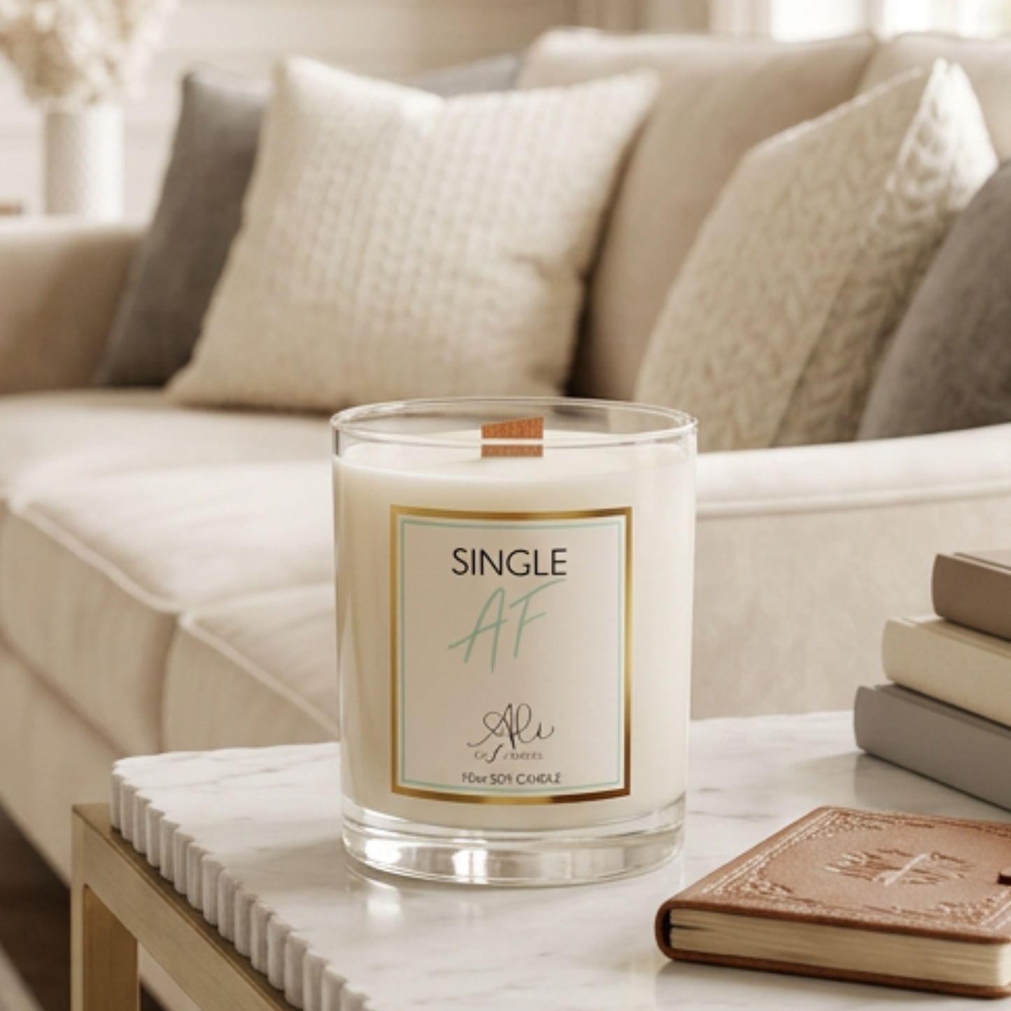 Candle labeled 'Single AF' on a marble surface with a couch in the background
