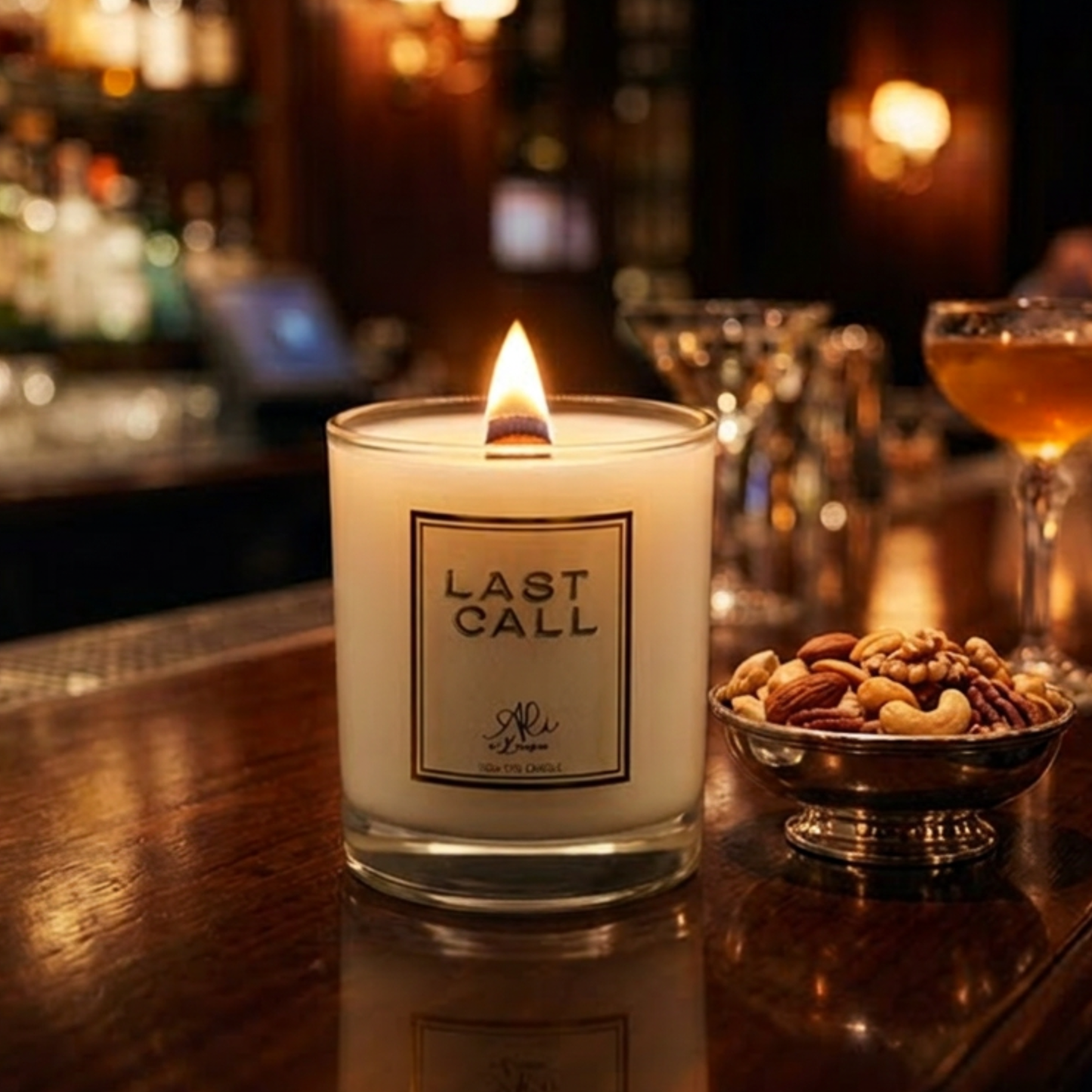 Lit LAST CALL wood wick candle with toasted almond fragrance by Karys Layne