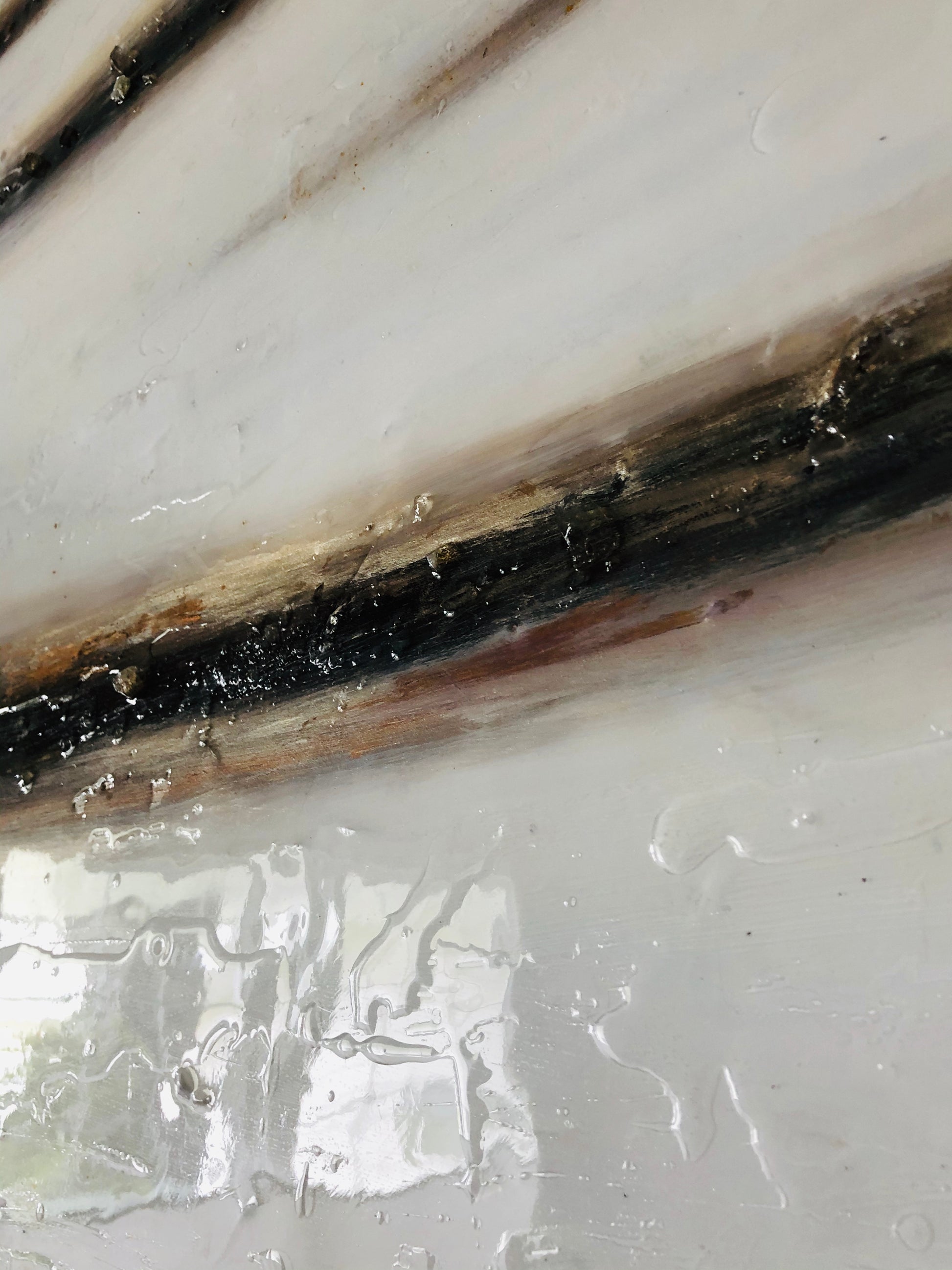 Resin, crystals, and mica create layers in this abstract artwork